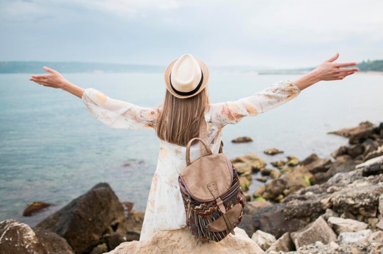 back-view-stylish-traveller-enjoying-vacation_23-2148588596